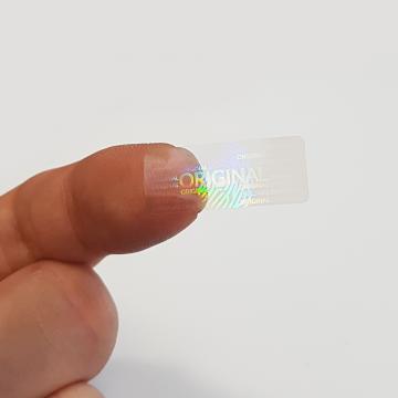 Transparentná hologramová samolepka originál s motívom odtlačku prsta 25x10mm